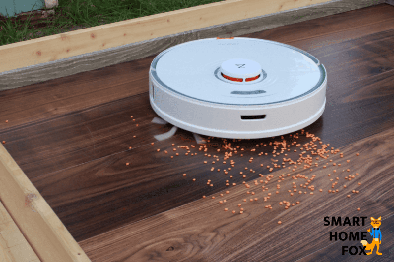 The Roborock S7 vacuums lentils during the suction test on a laminate floor